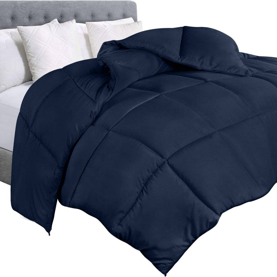 Edredon premium azul oscuro acolchado en cama